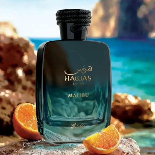 Rasasi HawasMalibu  perfume bottle with orange slices on a beach background